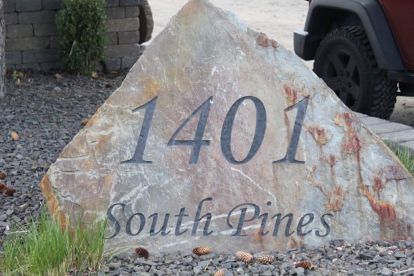 Large engraved stone rock as address for Gibsons Hardscape in Eastern Washington